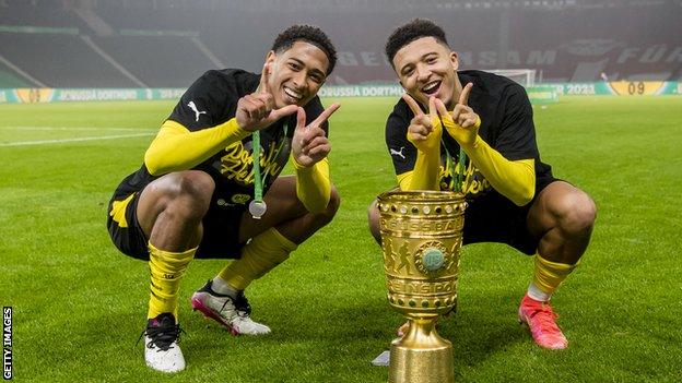 Jadon Sancho (right) and England team-mate Jude Bellingham helped Borussia Dortmund win the German Cup final in May