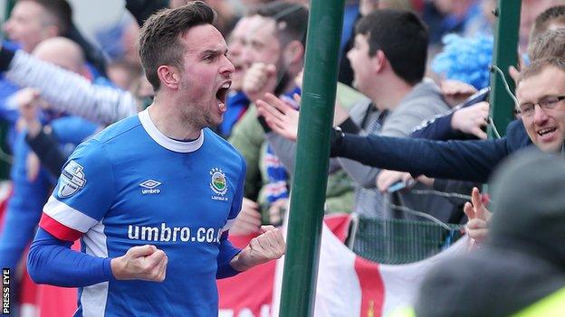 Andrew Waterworth celebrates scoring in the win over Cliftonville which secured the title