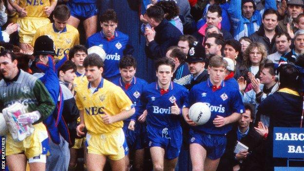 Oldham and Everton players leave the tunnel at Boundary Park