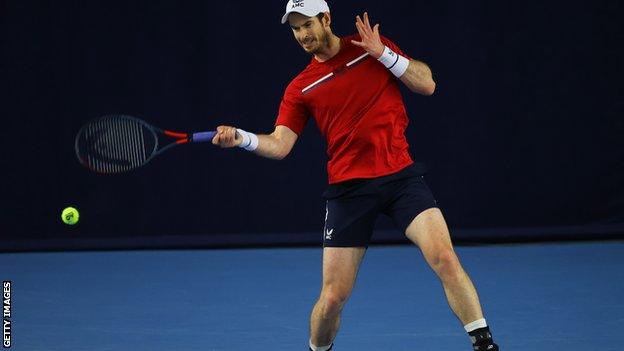 Andy Murray hits a forehand