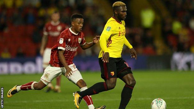 Isaac Success of Watford holds off Niclas Eliasson of Bristol City