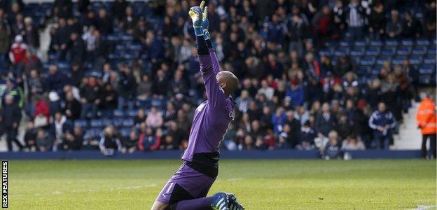 Heurelho Gomes celebrates one of his two penalty saves