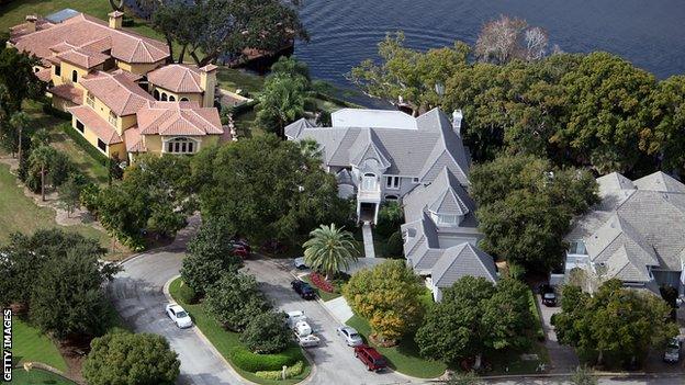 WINDERMERE, FL - DECEMBER 01: Tiger Woods' home (centre) is seen on December 1, 2009 in Windermere, Florida. Woods has not spoken with media or Florida Highway Patrol since he drove his SUV into a fire hydrant and a tree near the entrance to his neighbour's driveway, seen to the right, in the early hours of November 27. (Photo by Joe Raedle/Getty Images)