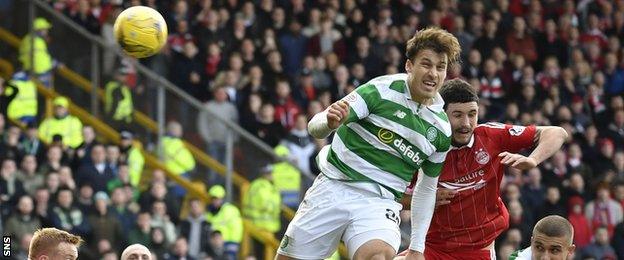 Erik Sviatchenko's header towards his own goal is saved by Celtic keeper Craig Gordon