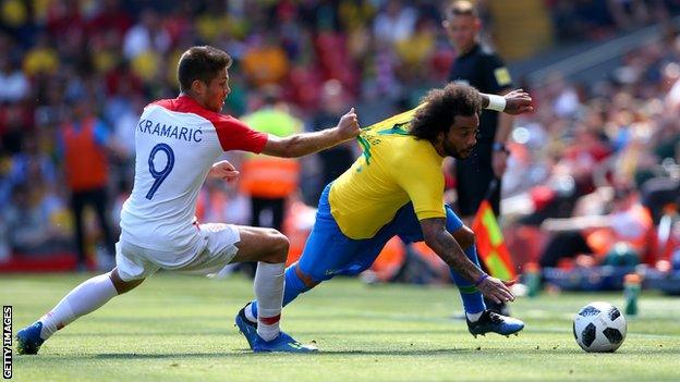 Hoffenheim forward Kramaric hauls back the run of Real Madrid defender Marcelo