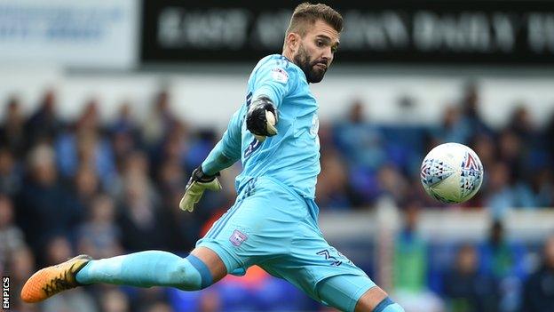 Bartosz Bialkowski kicks the ball from his hands