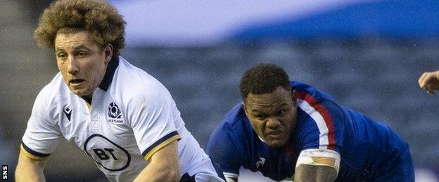 Scotland's Duncan Weir drives forward away from France's Virimi Vakatawa