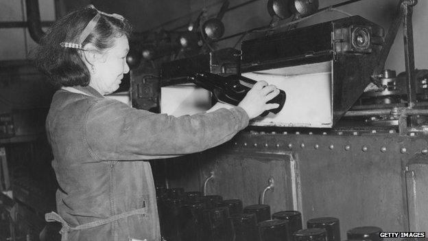 Bottles being examined at the Whitbread brewery in London in 1947