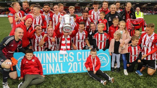 Derry celebrate winning the League Cup for the first time since 2011