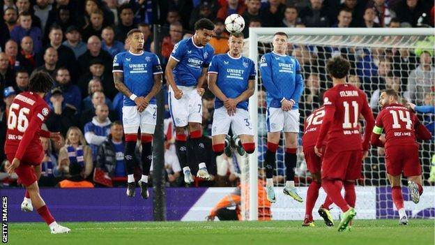 Trent Alexander-Arnold (left) scores for Liverpool