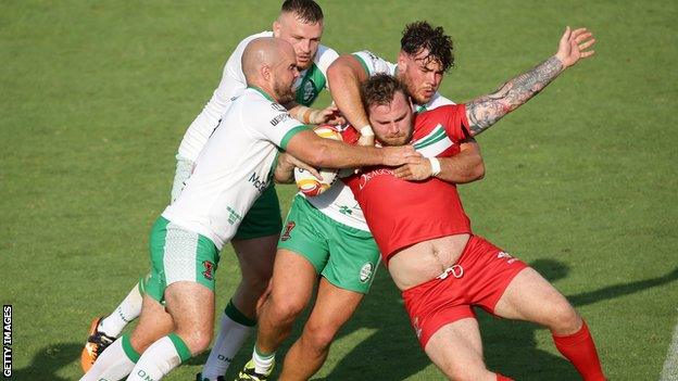 Wales' Ben Evans is stopped by the Ireland defence