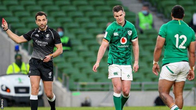 Referee Mathieu Raynal sends off Bundee Aki (right)