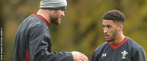 Jamie Roberts makes a point to Keelan Giles during Wales training