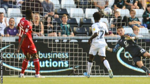 Swansea keeper Freddie Woodman is unable to reach Alfa Semedo's late strike