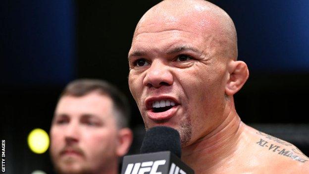 Anthony Smith speaks on the mic after a fight