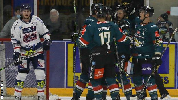 Belfast celebrate one of their seven goals in the one-sided encounter