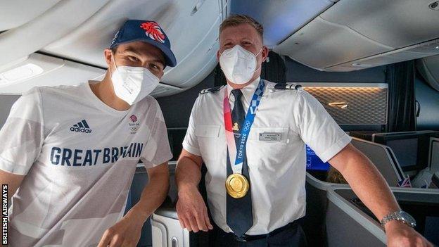 Joe Choong with a British Airways staff member