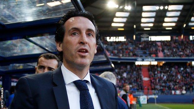 Unai Emery watches Paris St-Germain play