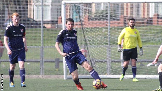 Rob McPherson playing for the Village Manchester football team