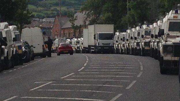 Police vehicles are in place in the Woodvale Road area of Belfast on Monday evening