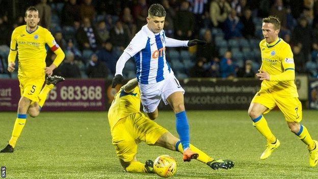 Kilmarnock's Jordan Jones is brought down by St Johnstone's Jason Kerr