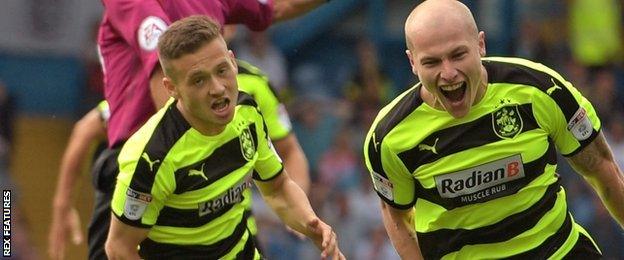 Aaron Mooy celebrates his goal for Huddersfield