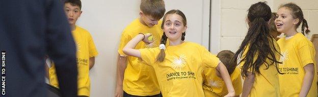 Girls and boys taking part in a Chance to Shine event with James Taylor