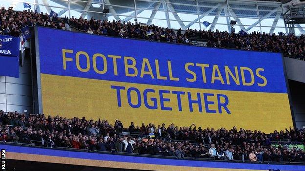 A screen saying Football Stands Together at Wembley in a show of support for Ukraine before the Carabao Cup final