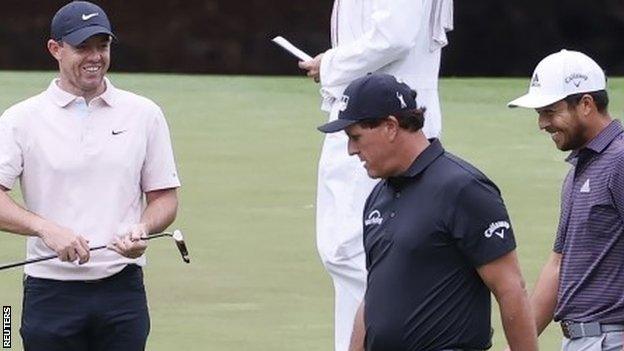 (l-r) Rory McIlroy, Phil Mickelson and Xander Schauffele