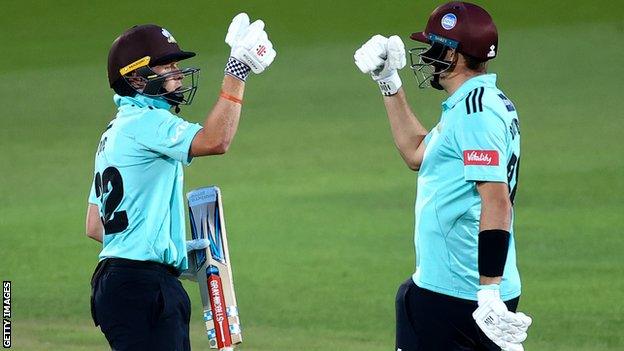 Ollie Pope and Jamie Overton punch gloves for Surrey