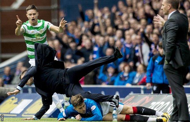 Rangers manager Pedro Caixinha is sent flying after a collision with Ibrox midfielder Josh Windass