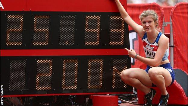 Sophie Hahn by the London Stadium scoreboard