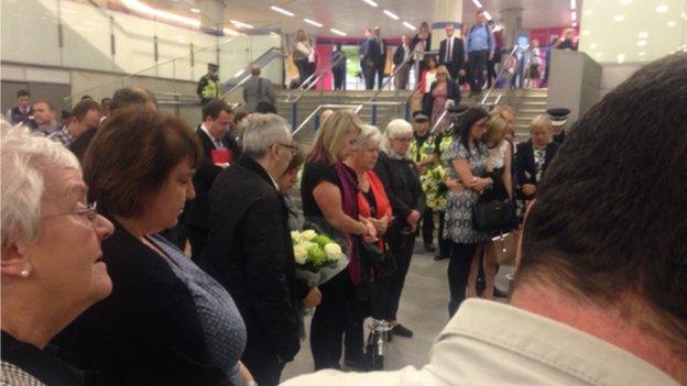 People remember the victims of 7/7 at King's Cross on the 10th anniversary of the bombings