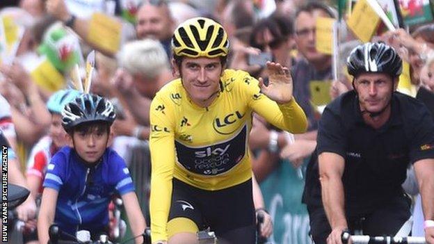 Geraint Thomas riding his bike at his homecoming