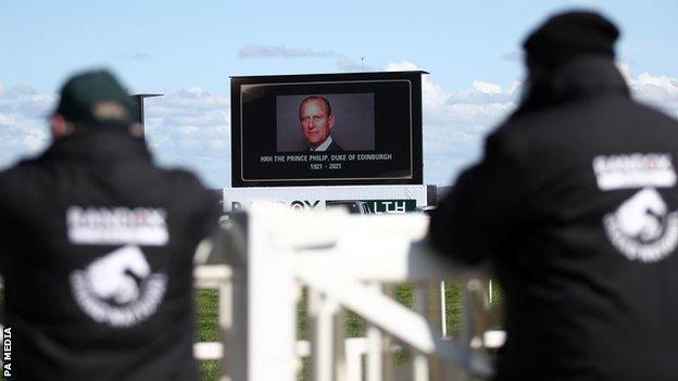 A tribute on a big screen for the late Prince Philip, Duke of Edinburgh, ahead of Ladies Day of the 2021 Randox Health Grand National Festival at Aintree Racecourse