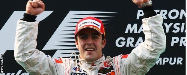 Fernando Alonso celebrates winning the 2007 Malaysian GP