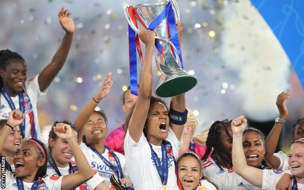 Wendie Renard lifting the Champions League trophy