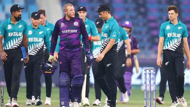 Scotland's Michael Leask walks off after a 16-run loss to New Zealand in 2021's T20 World Cup