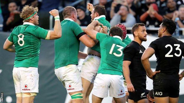 Ireland players celebrate after Robbie Henshaw secures their fifth try to secure victory