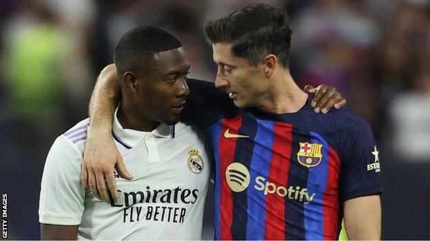 David Alaba of Real Madrid and Robert Lewandowski of Barcelona talk during the preseason friendly match July 23, 2022