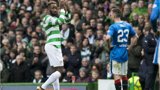 Moussa Dembele applauds the fans after being substituted against Rangers