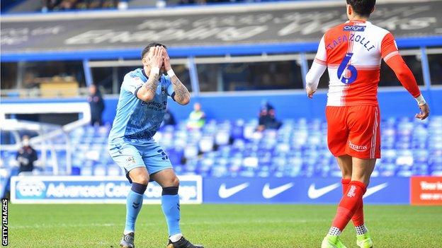 Gustavo Hamer holds his head in his hands after he missed a chance to put Coventry ahead