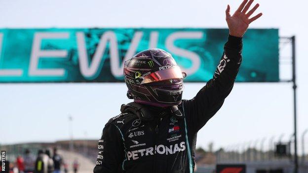 Lewis Hamilton waves to the crowd