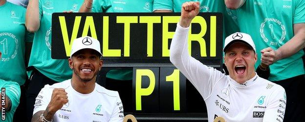 Valtteri Bottas and Lewis Hamilton pose for a celebration shot after the Austrian GP