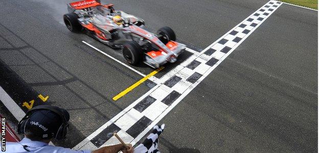 Lewis Hamilton crosses the finish line to win the 2008 British Grand Prix at the Silverstone