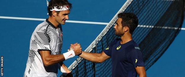 Roger Federer and Noah Rubin