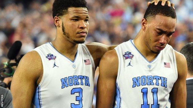 Kennedy Meeks and Brice Johnson in tears after the game