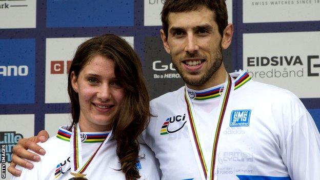 Gee Atherton (R) and Manon Carpenter celebrate winning the Elite Downhill class of the 2014 UCI Mountain Bike & Trials World Championships