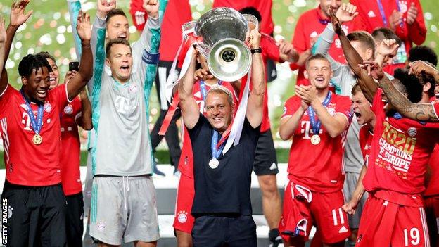 Hansi Flick lifts the Champions League trophy