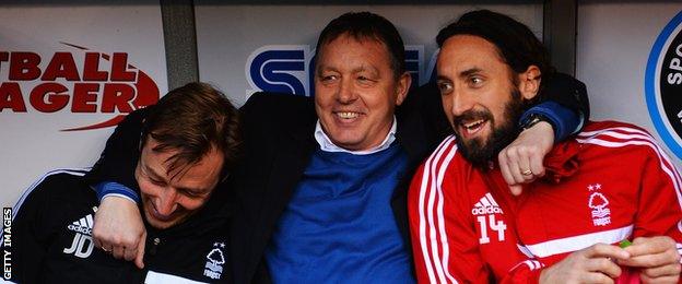 Nottingham Forest manager Billy Davies jokes with coach Julian Darby and Jonathan Greening